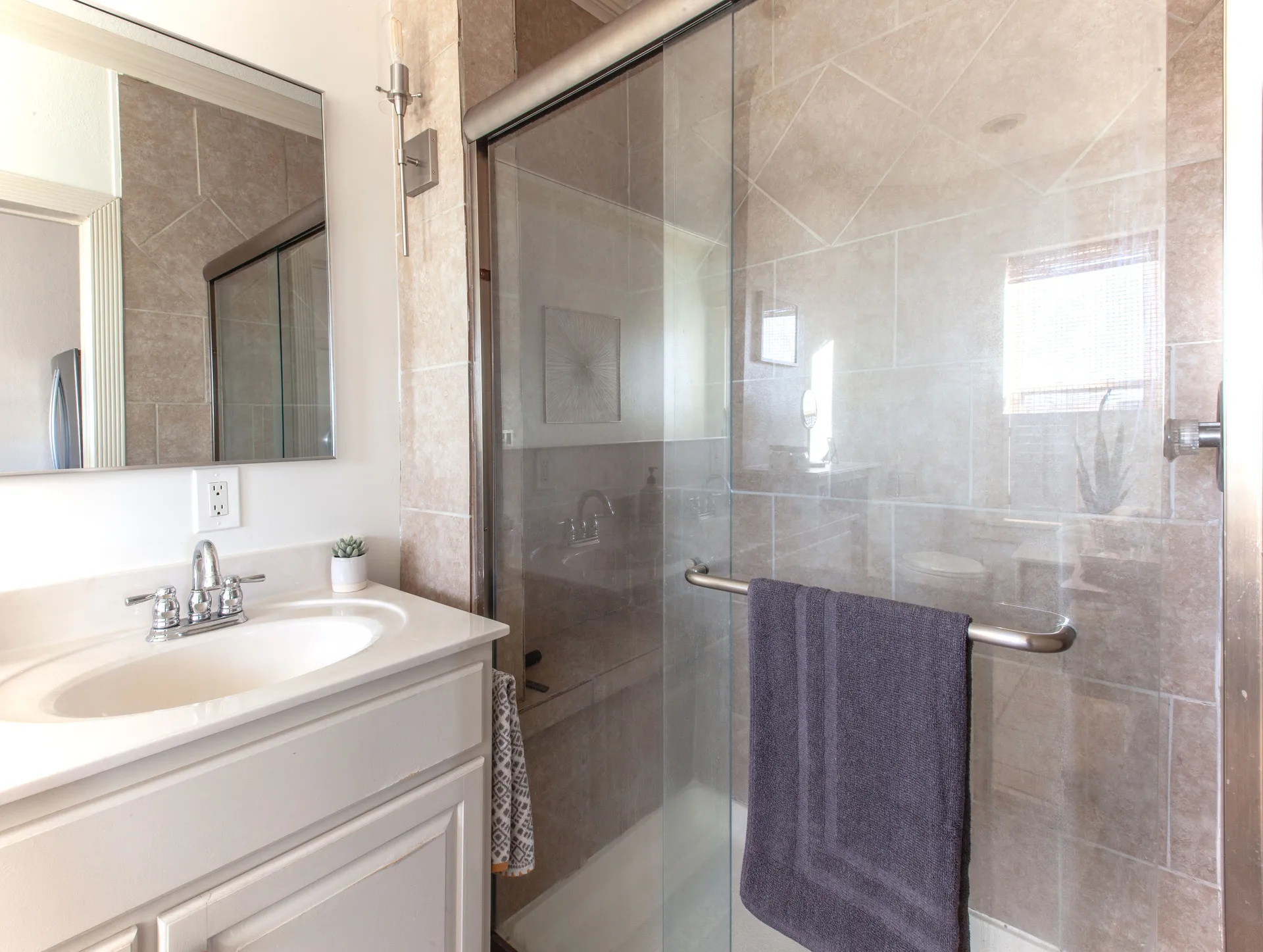 Loft B modern bathroom with walk-in shower and complimentary toiletries