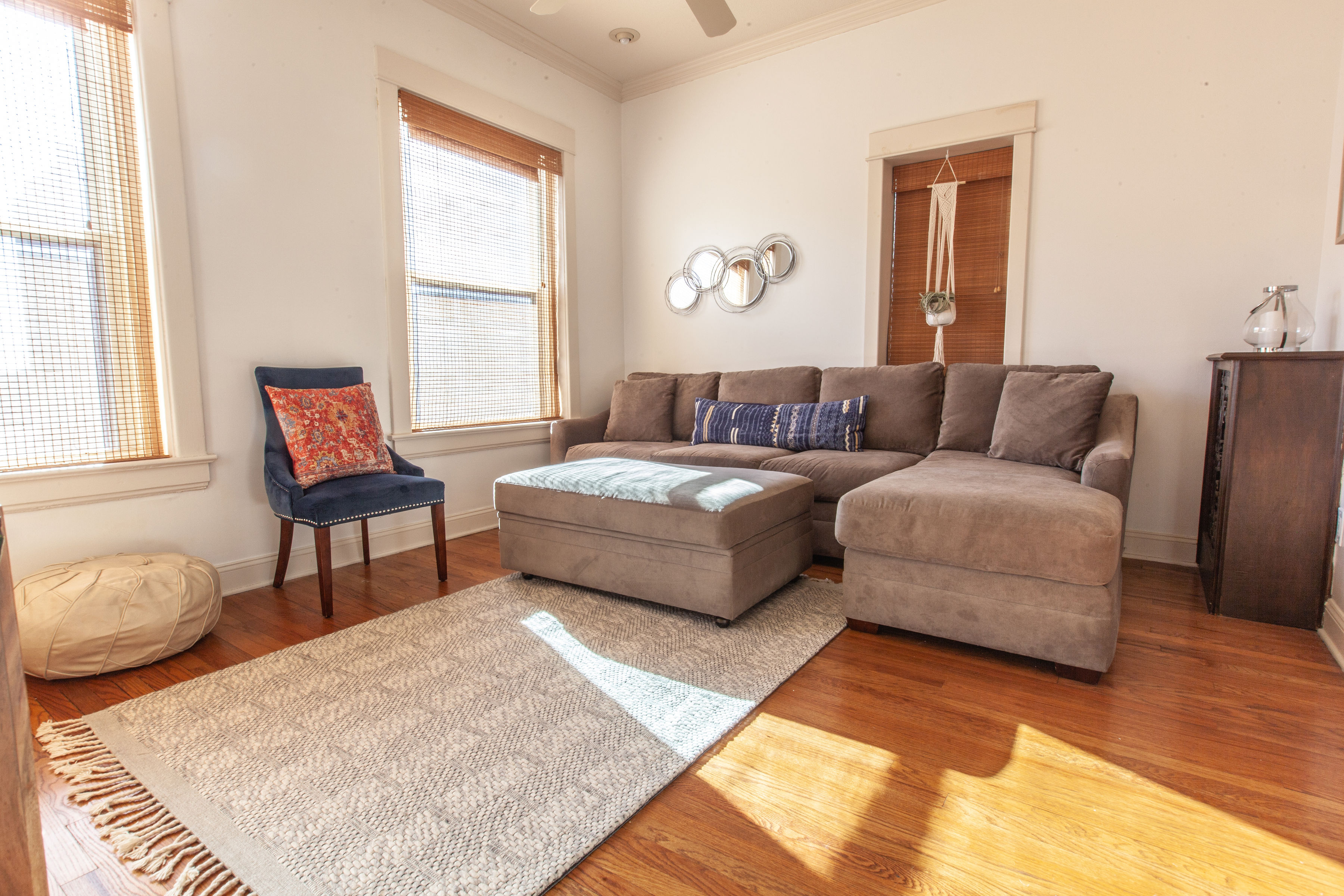 Three Trails Lofts living room with 65-inch TV and modern furnishings on Independence Square